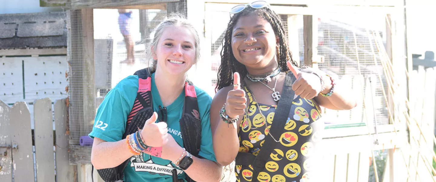Staff giving thumbs up