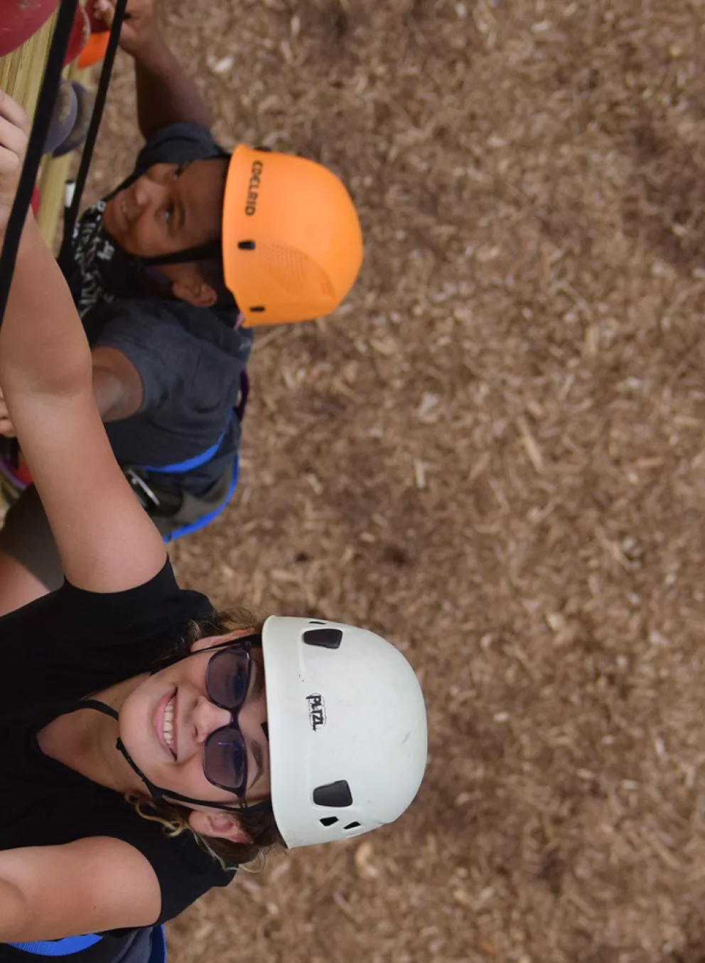 campers climbing the climbing wall