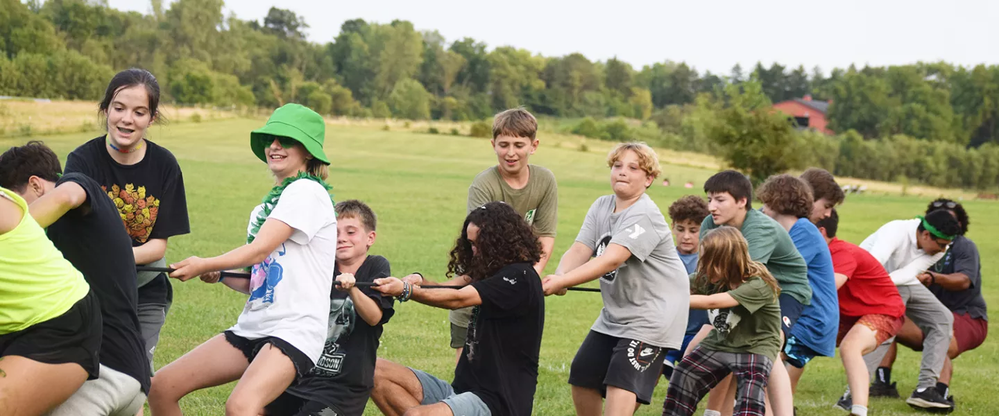 Campers playing tug of war