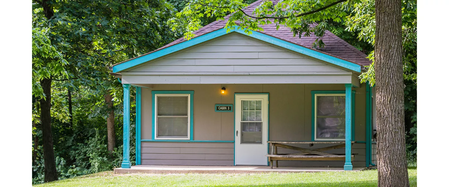 gray cabin with blue trim