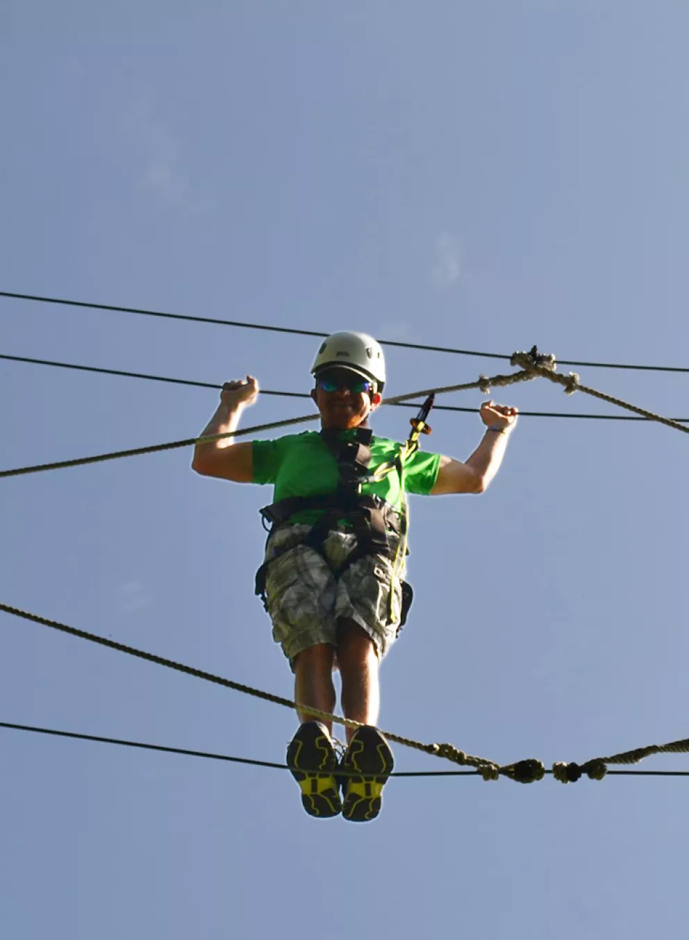 Camper on high ropes course