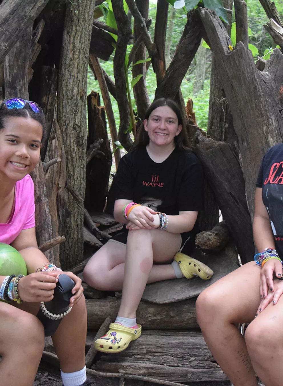 campers sitting in the woods