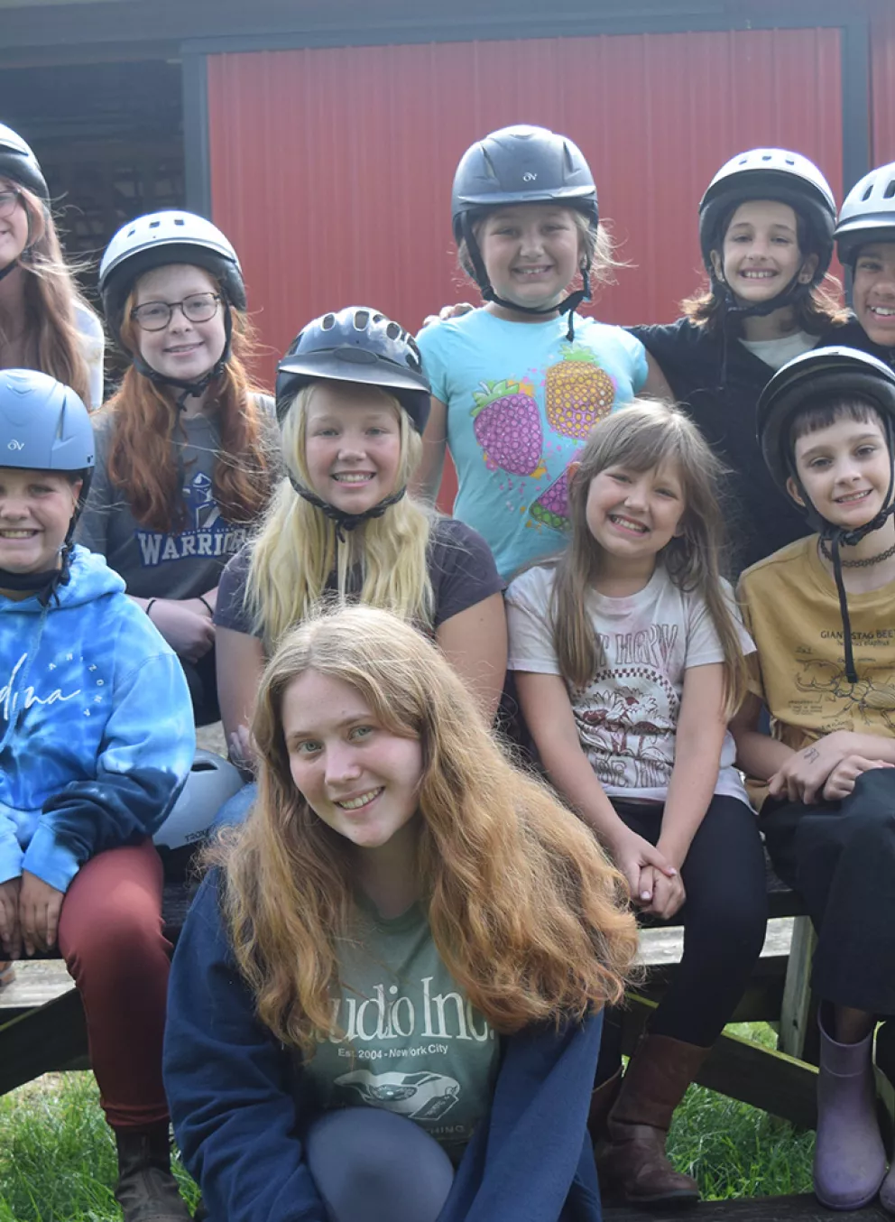 Campers in helmets at the ranch