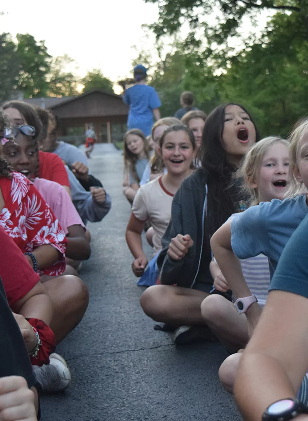 group of kids sitting outside