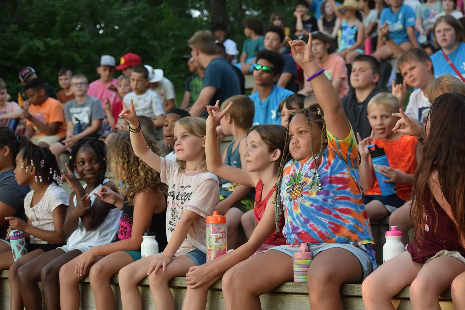campers raising hands