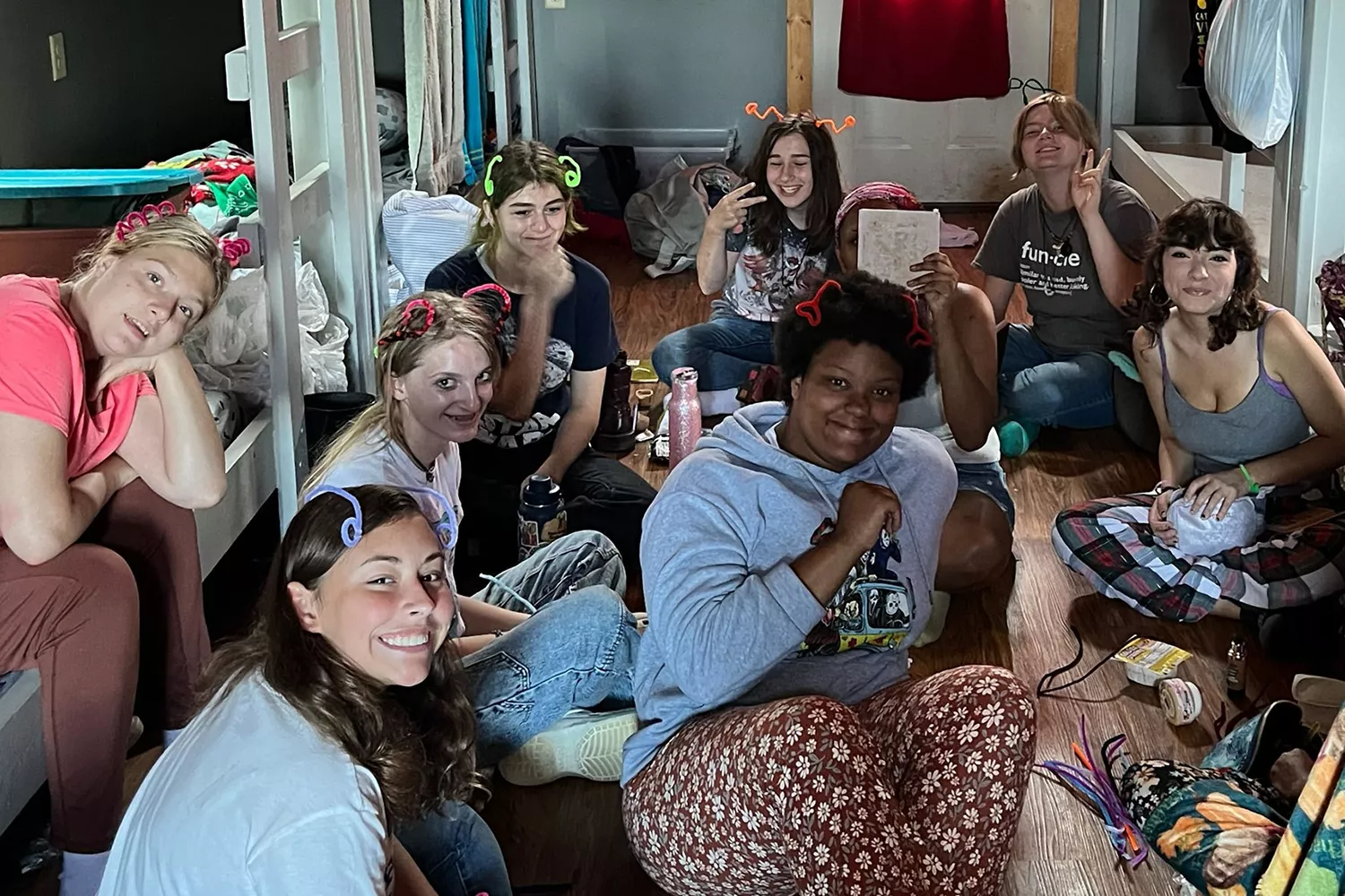 Campers sitting together in a cabin