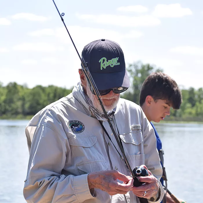 Fisherman checking a fishing pole