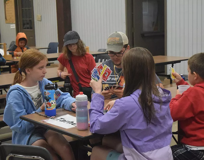 campers playing a card game