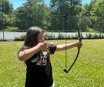 camper participating in archery