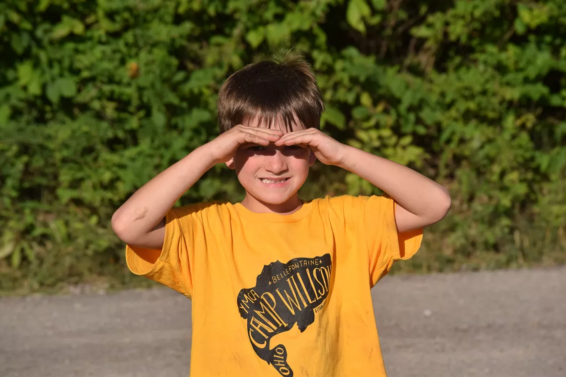 camper wearing a camp shirt