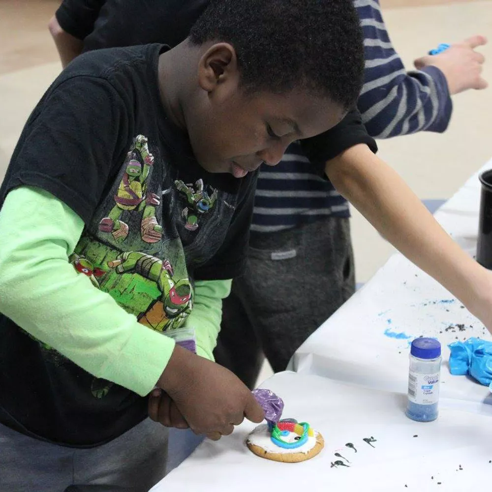 Camper decorating a cookie