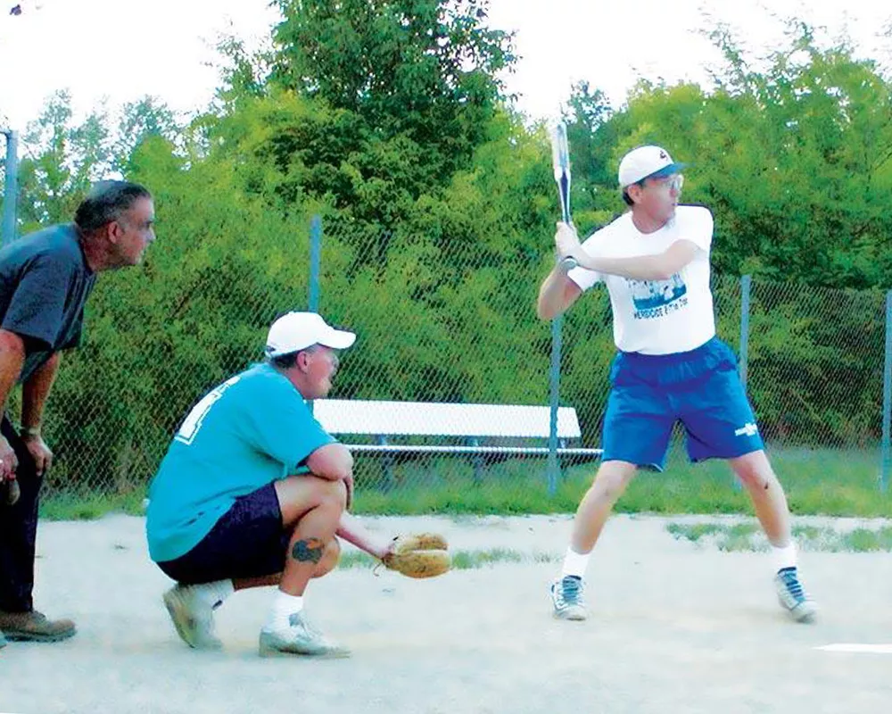 men's campers playing softball