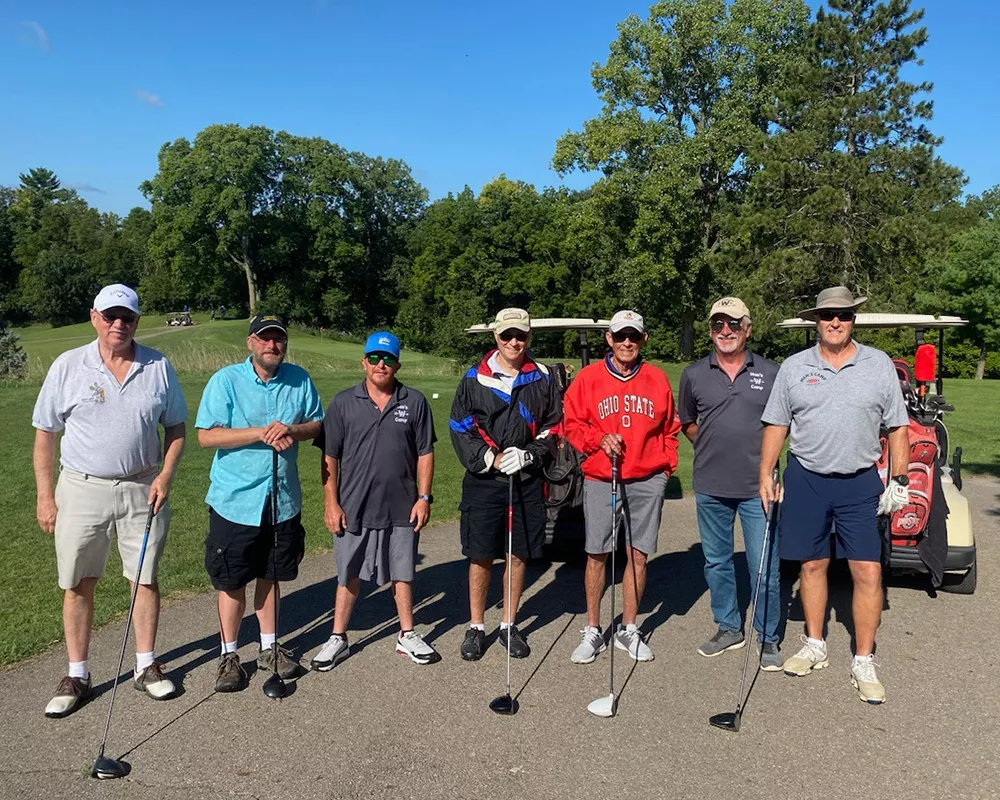 group of men playing golf