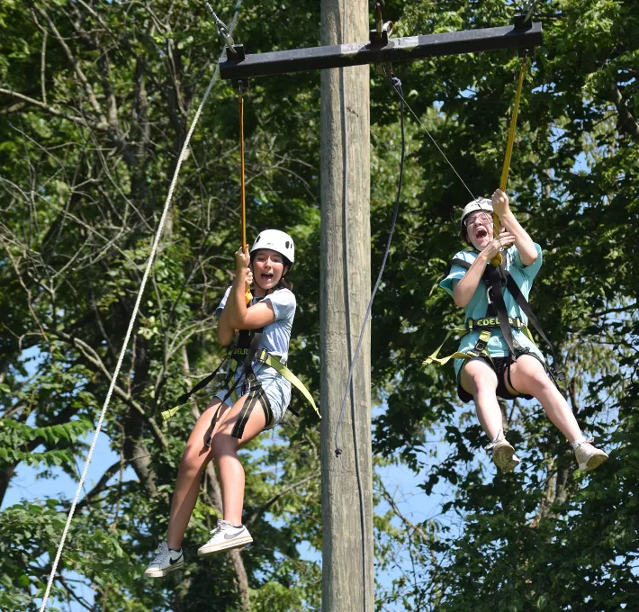 campers riding the giant swing